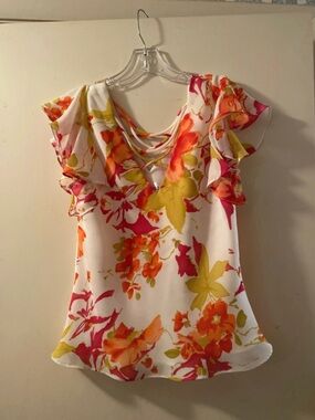 Studio I Size 8 multi floral with ruffled sleeves and strappy details at neck.